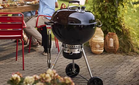 Weber Master-Touch 57 cm charcoal kettle BBQ at a garden party